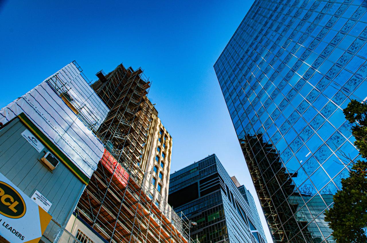a group of tall buildings next to each other